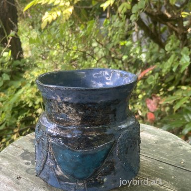 small blue vase with birds