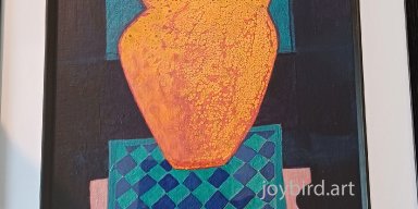 Orange Vase on Checkered Rug